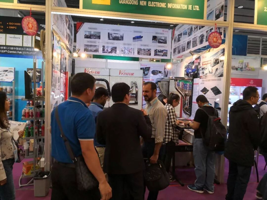 Inside the 123rd China Import and Export Fair complex, the WINFOR pickup bed systems booth beside the official Canton Fair signage