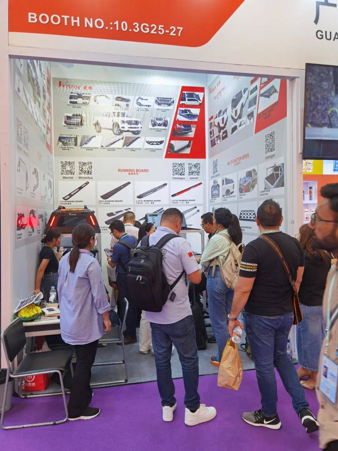 Queue of buyers waiting for consultations in front of the WINFOR stand at the 136th Canton Fair, a packed booth