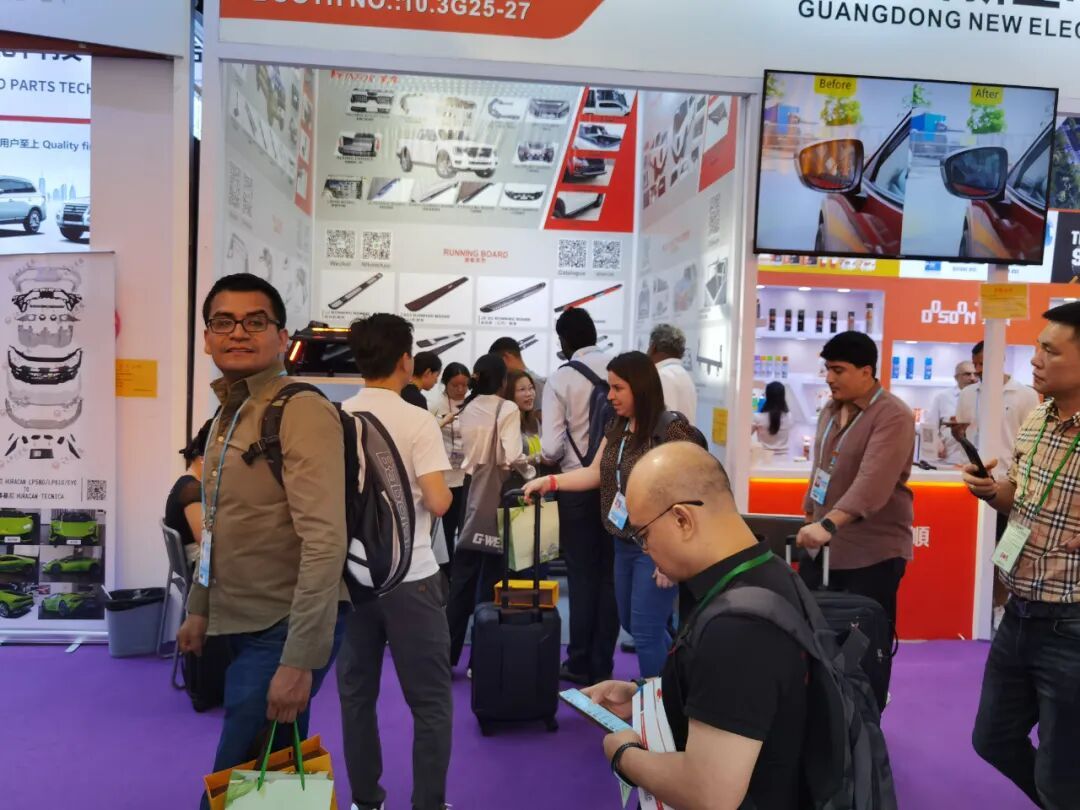 Busy aisle inside the Canton Fair complex with a steady stream of visitors past the WINFOR booth during the 136th session