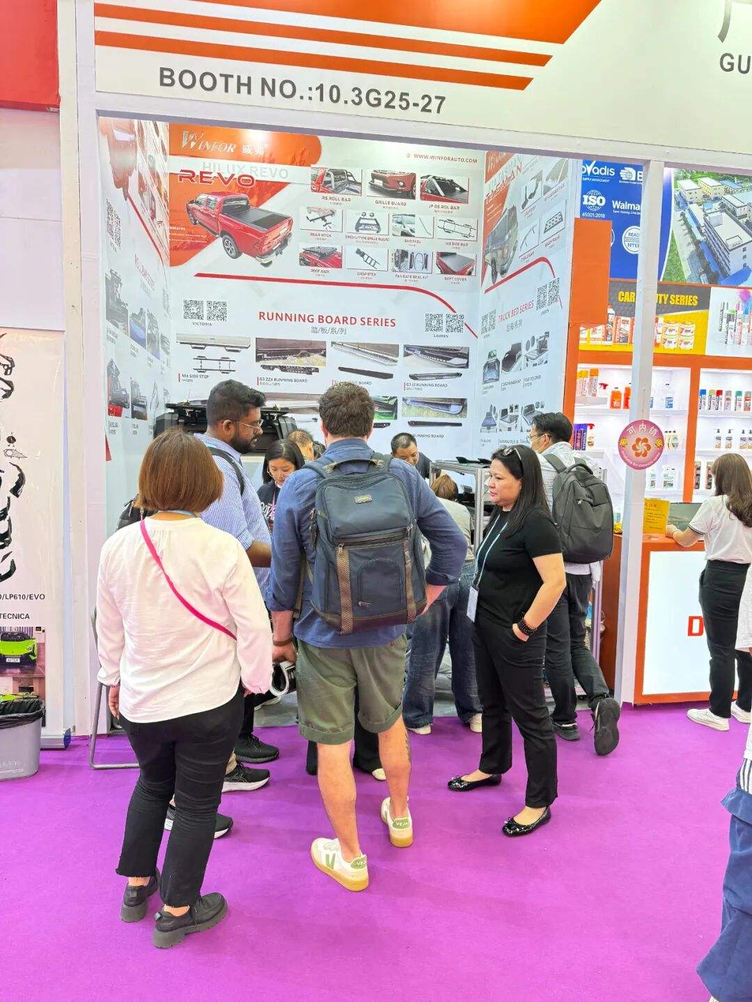 Buyers crowding around the WINFOR stand at the 138th Canton Fair, talking with staff in a packed aisle