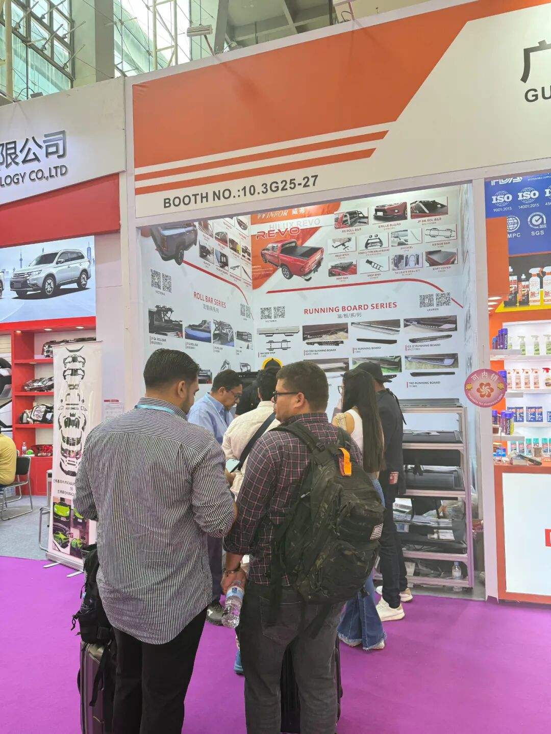 Customer consulting with a WINFOR representative inside the Canton Fair booth, negotiation area full throughout the show