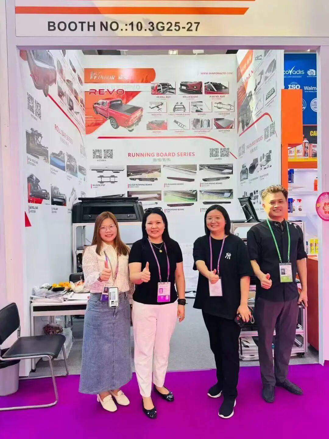 WINFOR booth team photo at the 138th Canton Fair, four colleagues standing in front of booth 16.3G25-27 with the product display wall behind them
